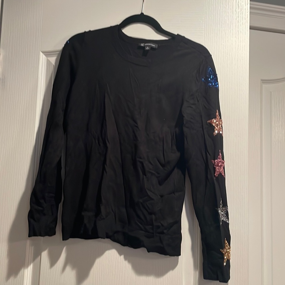 Black sweater sparkly star details on sleeves